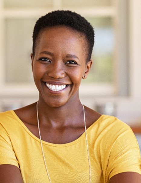 Woman in yellow shirt smiling