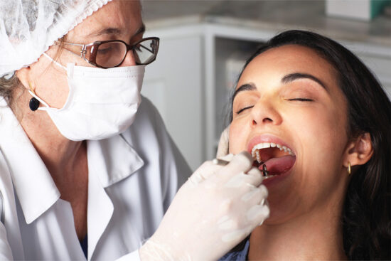 Dentist and patient.